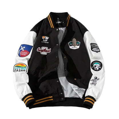 Black and white varsity jacket with multiple patches 